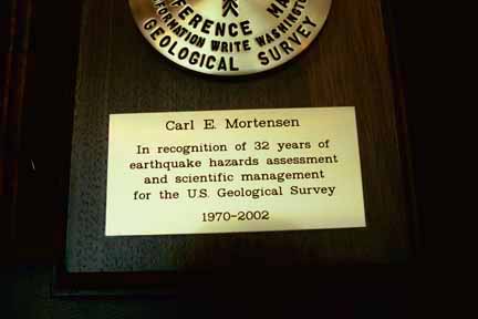 Photo, of inscription that reads Carl E Mortensen, in recognition of 32 years of earthquake hazards assessment and scientific management for the U.S. Geological Survey, 1970-2002