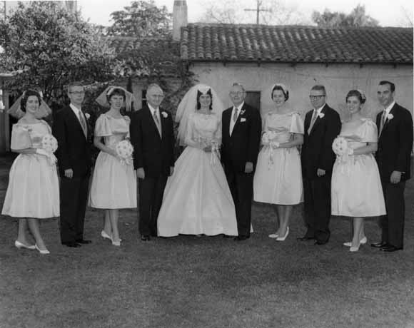 Photo of group with bride and groom