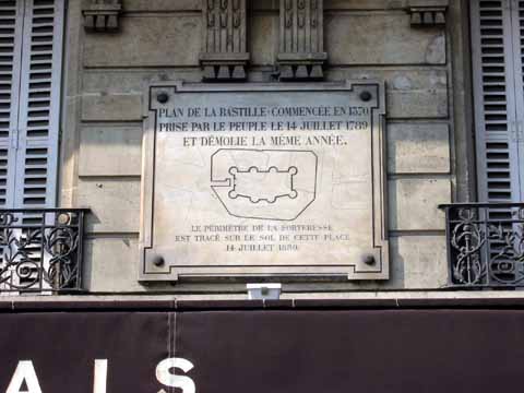 Photo, stone carved with illustration showing where the old prison once stood