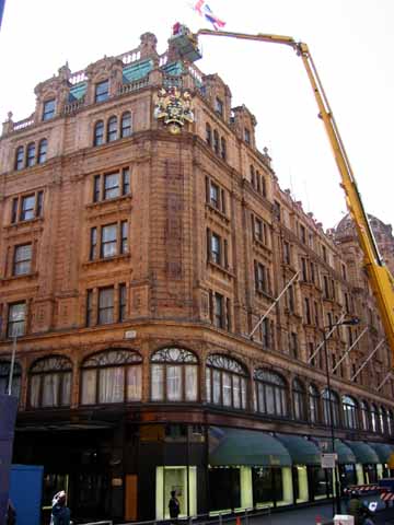 Photo, department store with lift holding worker