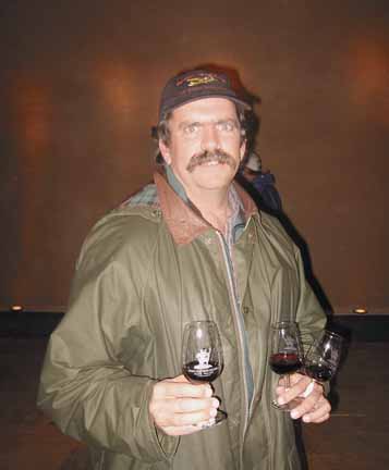 Photo of with three glasses of wine in his hands