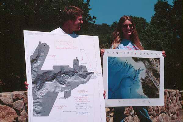 Students holding maps of canyon