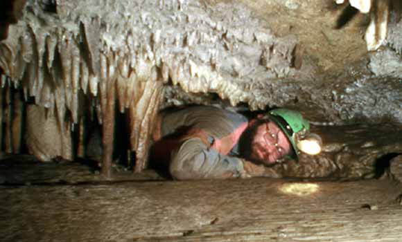 Photo of Bruce crawling through a very small hole