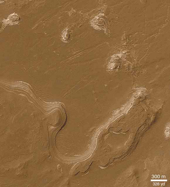 photo of surface of mars showing water-cut banks
