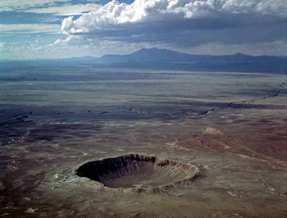 photo of large crater taken from the air looking at an angle