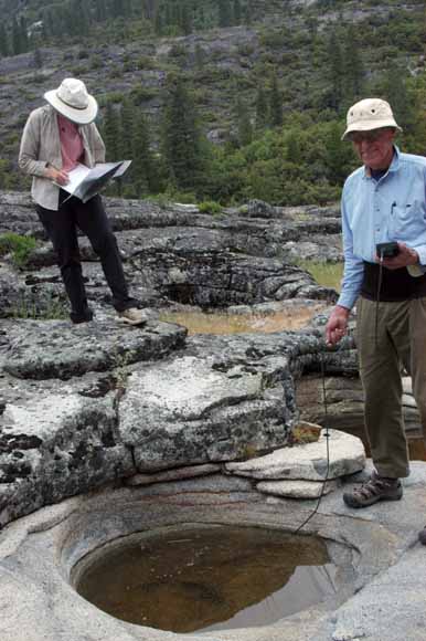 photo of Jim and Karen by meter-sized granite basin