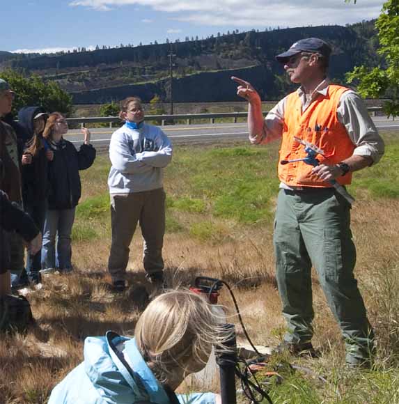 photo of Jon giving a lecture in the field