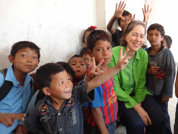 Photo of Anne with school kids in Nepal