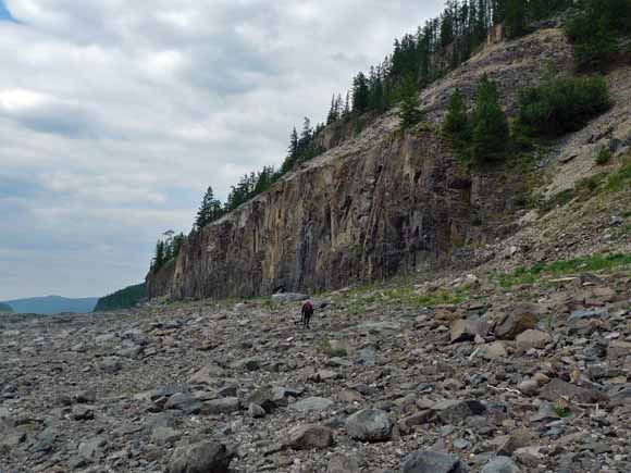 Photo of large sill; tiny geologist for scale