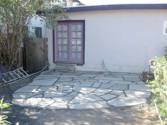 photo of stone patio and house