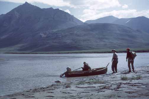 photo, three men at shore with small boat on Galbraith Lake