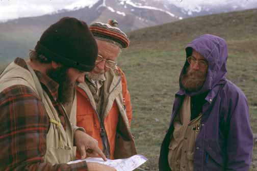 photo, three men using a map to make plans
